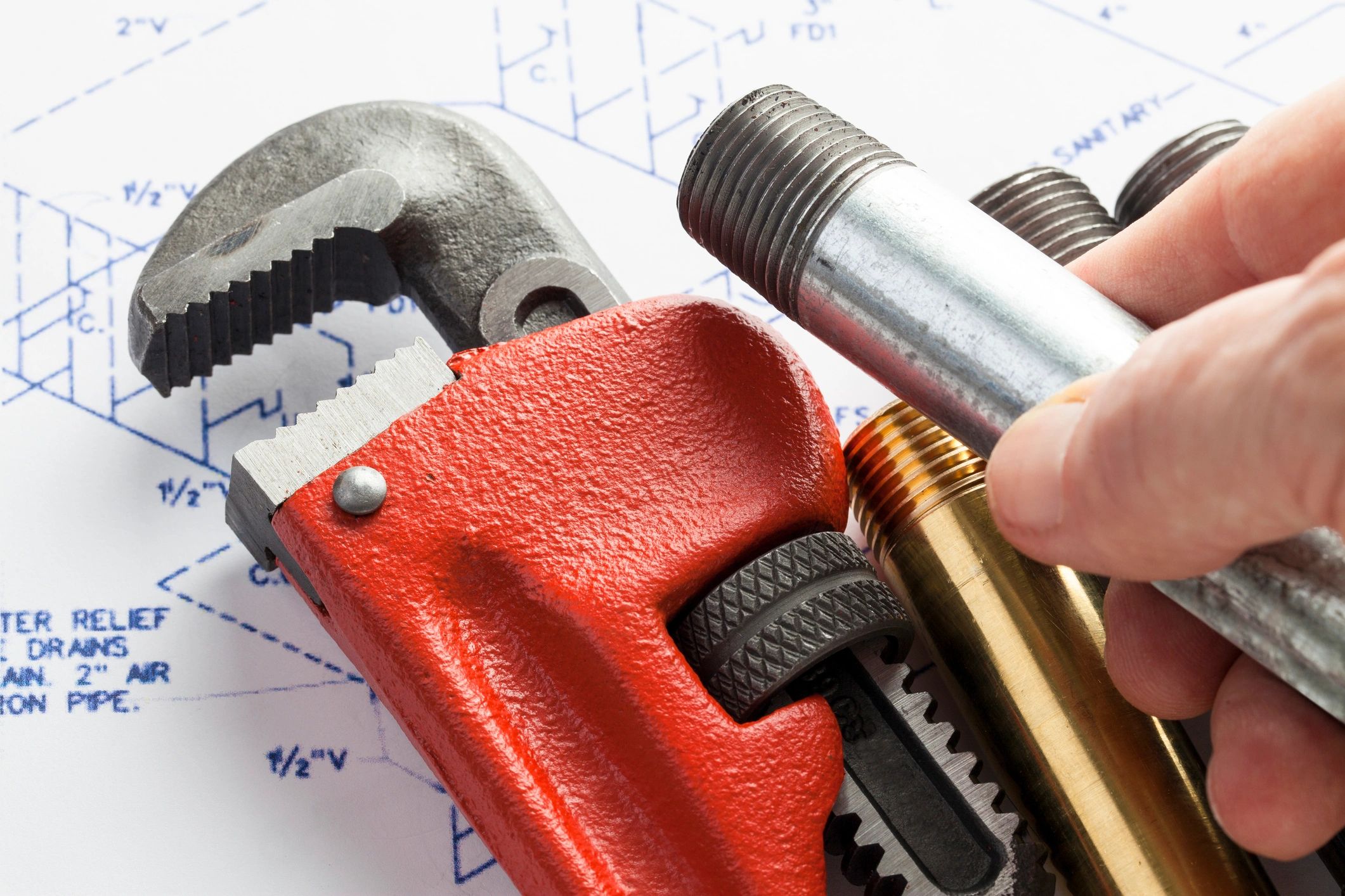 Plumbing tools arranged for a repair job
