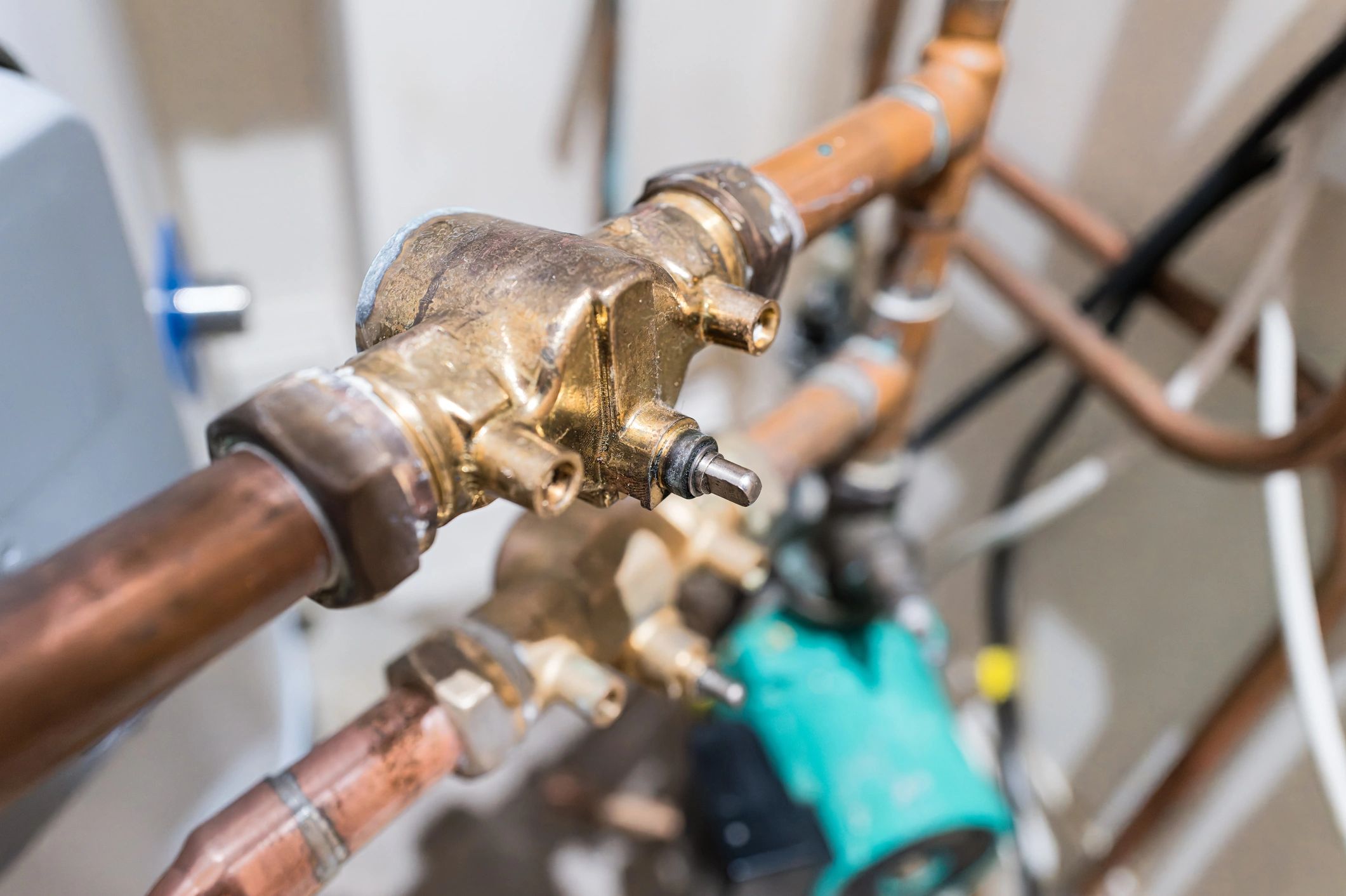Close-up of plumbing valve and copper piping