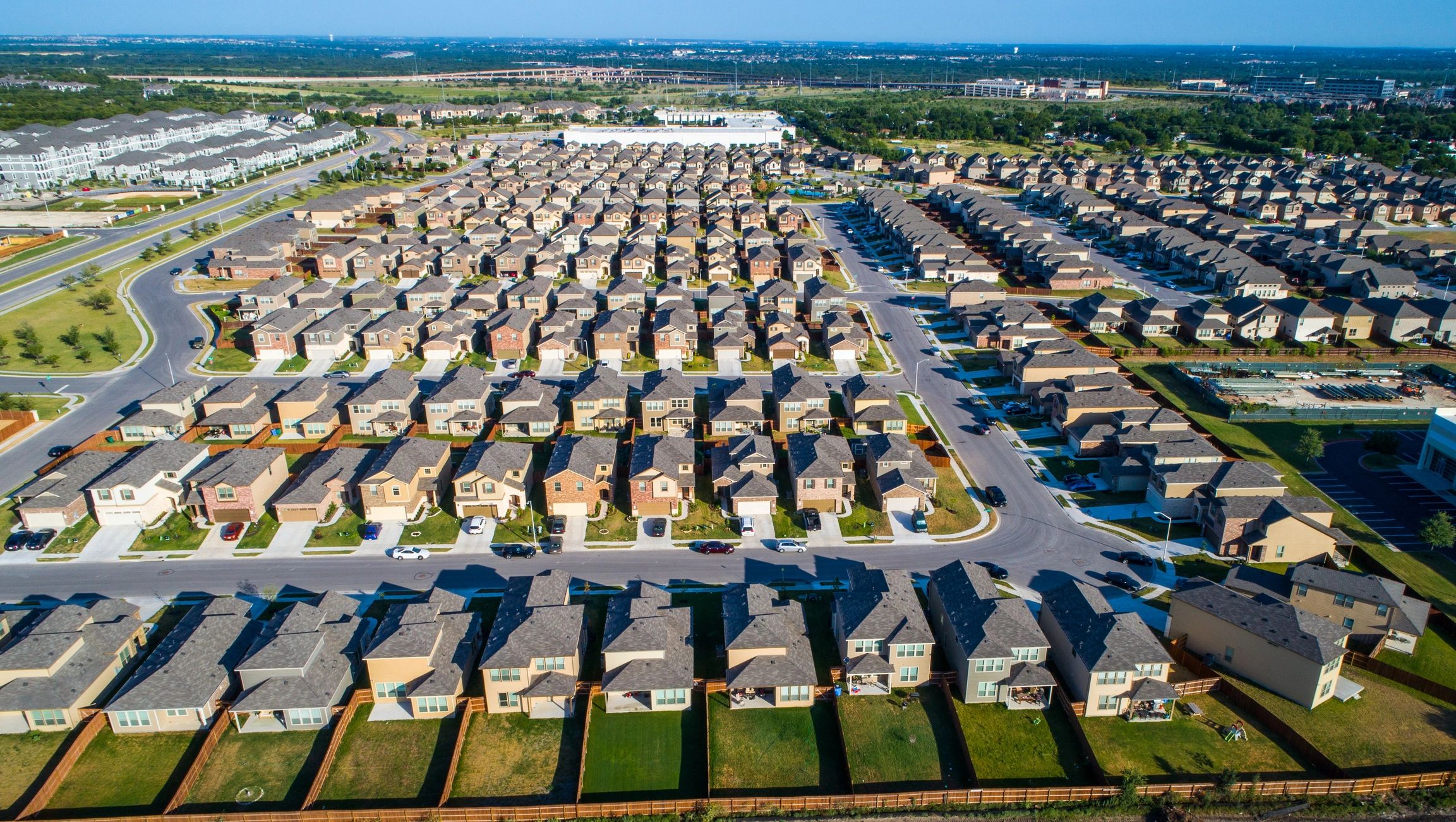 Aerial view of a tree-lined Texas neighborhood